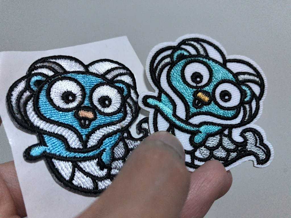Gophercon Singapore mascot embroidered stickers comparison between two vendors