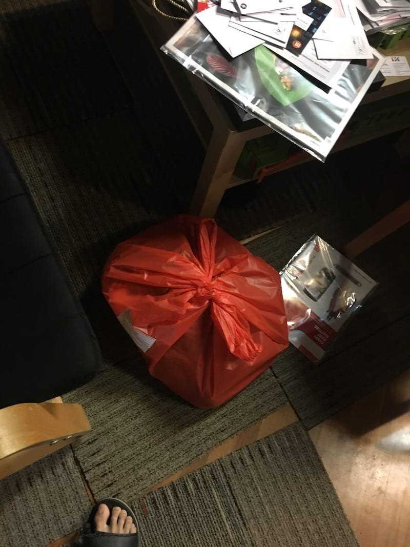 Plastic bag containing all the pixelated KopiJS t-shirts